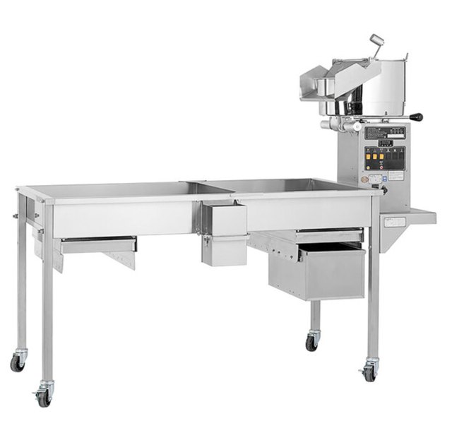 Cretors GKS-X 70 inch popcorn production table with pedestal kettle on casters